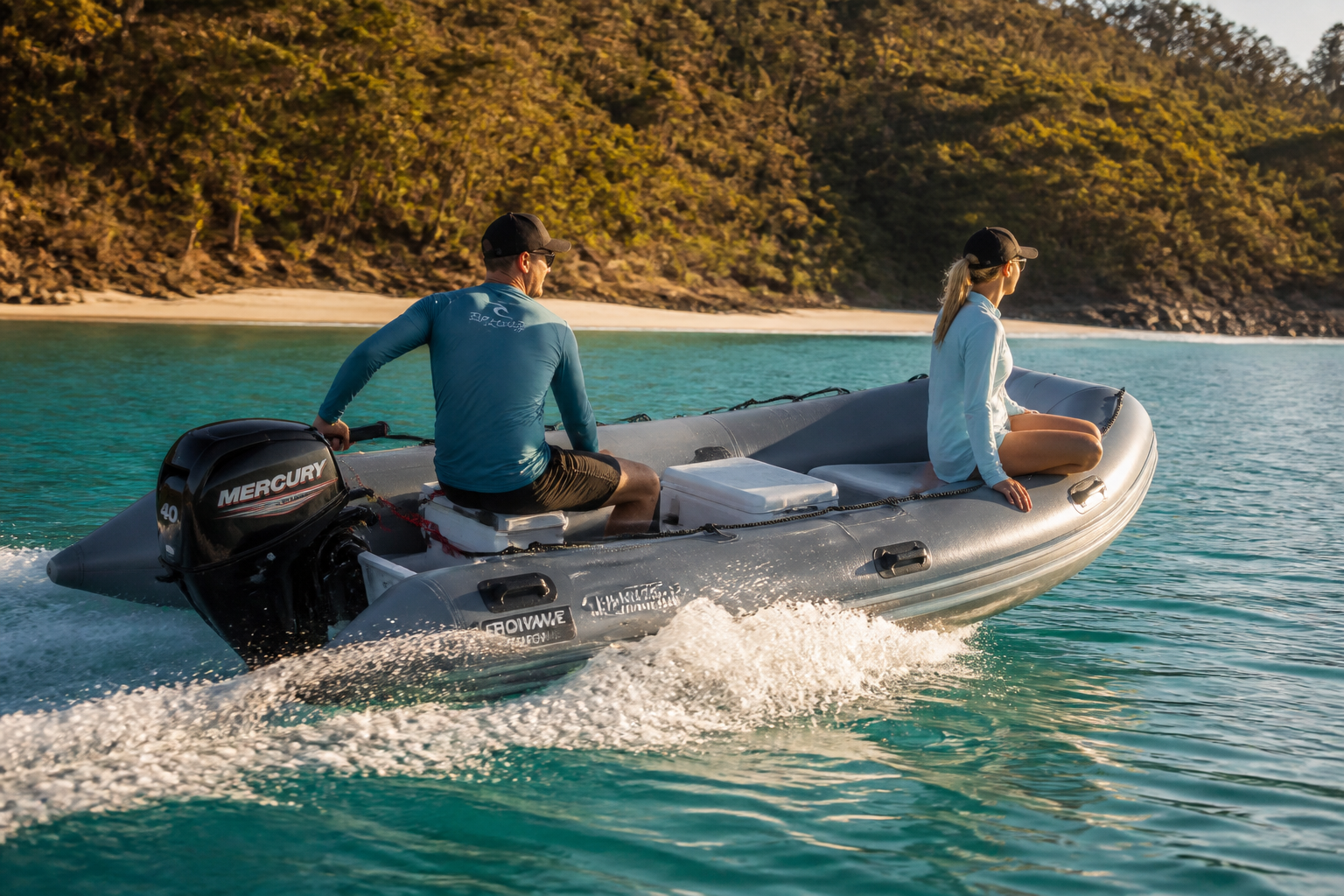 Aerowave Sport Series Offshore inflatable boat with two people aboard cruising through clear Australian waters — one person steering at the tiller, the other seated up front on the tube.